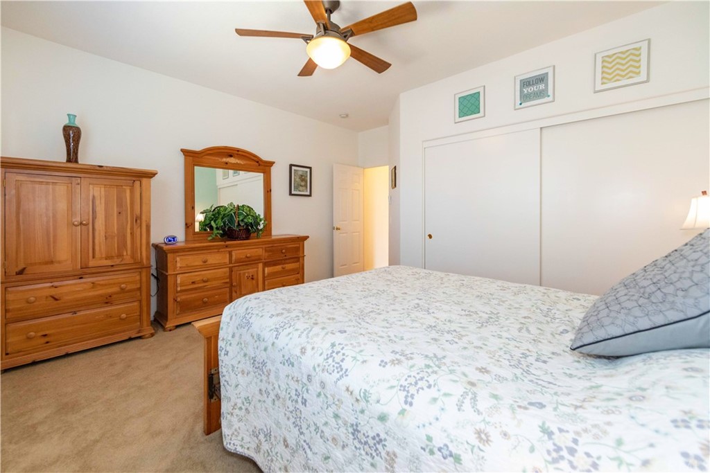 31271 Ensemble Drive Menifee, CA 92584 - Photo 17 of 30 a bedroom with a bed and a dresser