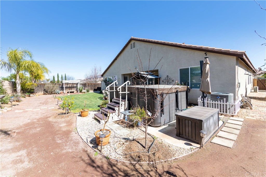 31271 Ensemble Drive Menifee, CA 92584 - Photo 25 of 30 a view of a patio with wooden fence