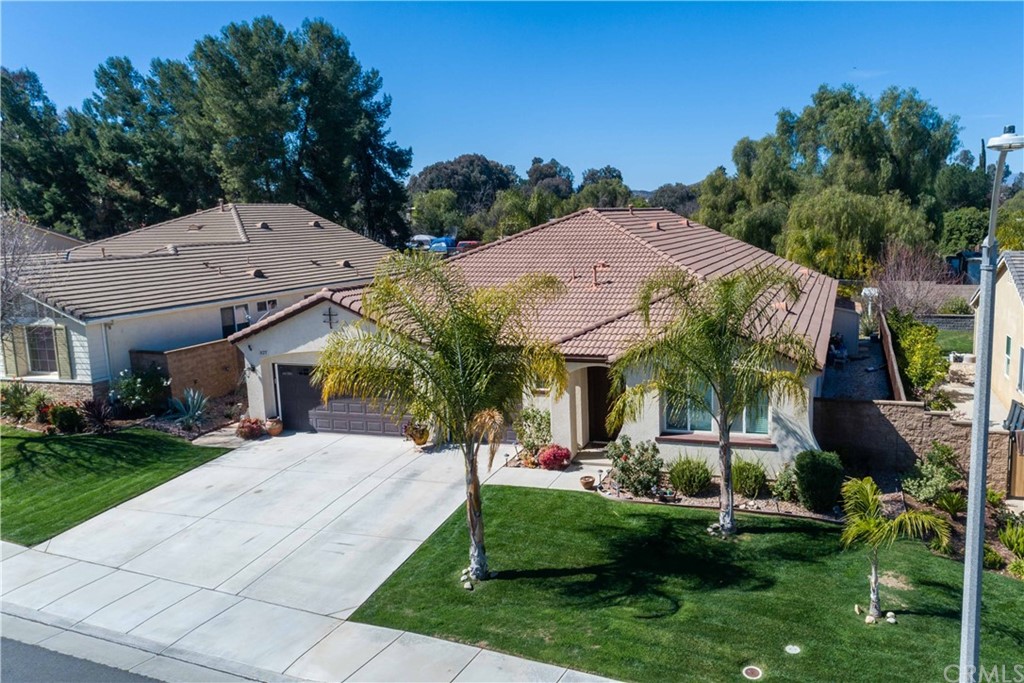 31271 Ensemble Drive Menifee, CA 92584 - Photo 6 of 30 a front view of house with yard and green space