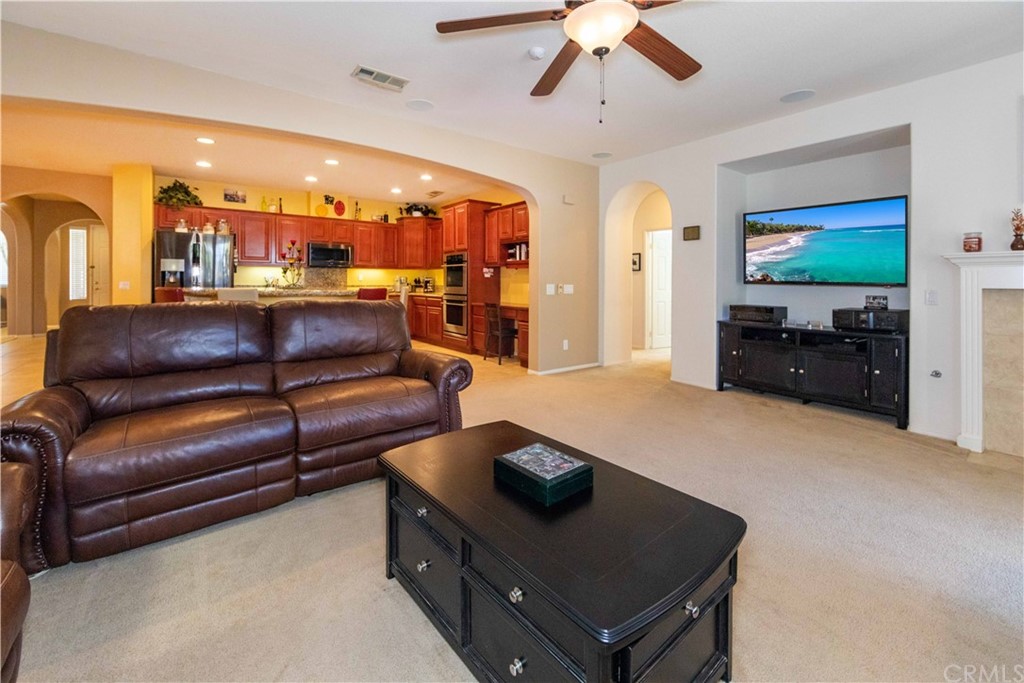 31271 Ensemble Drive Menifee, CA 92584 - Photo 8 of 30 a living room with furniture and a flat screen tv