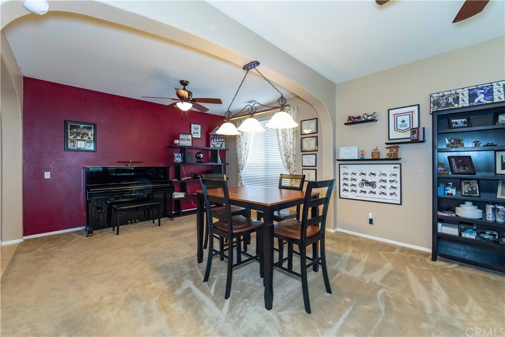 31271 Ensemble Drive Menifee, CA 92584 - Photo 9 of 30 a view of a dining room with furniture and chandelier