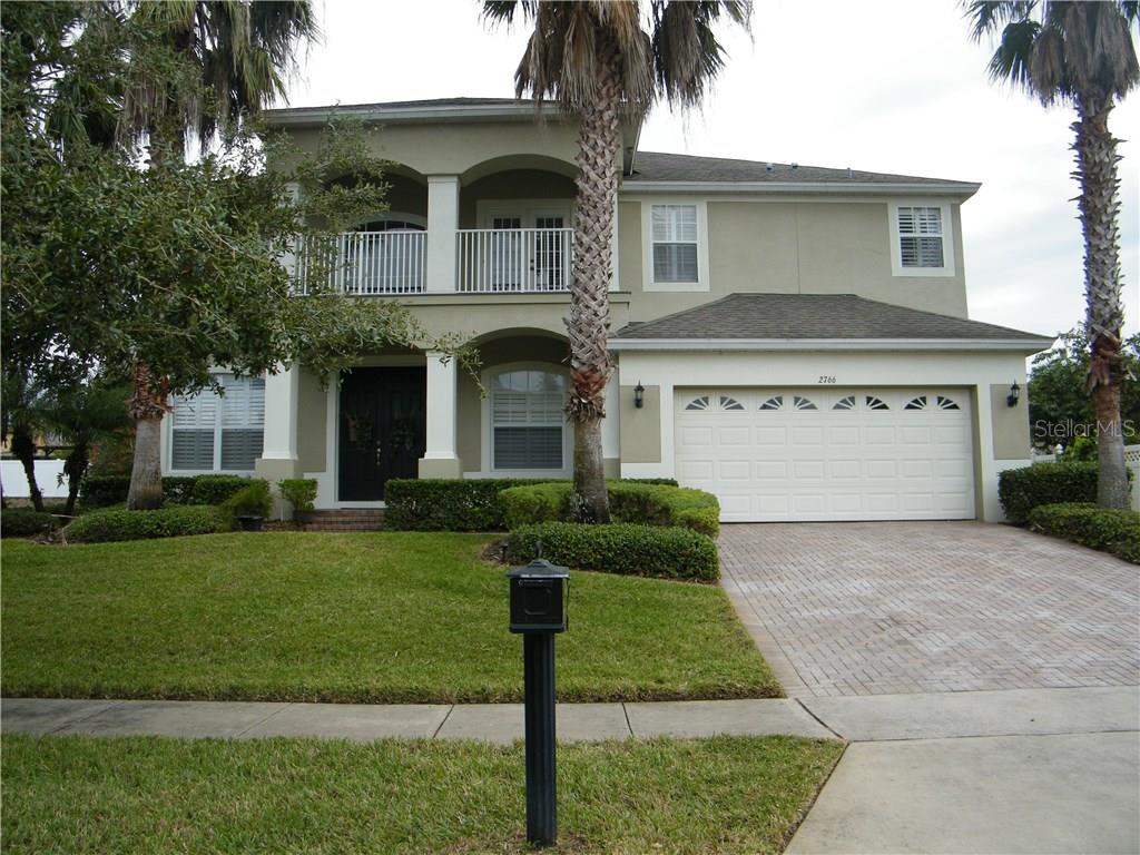 2766 Cardassi Drive Ocoee, FL 34761 - Photo 1 of 1 a front view of a house with a yard