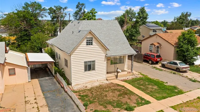 a view of house with wooden floor and outdoor seating