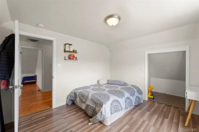 a bedroom with a bed and a view of bedroom