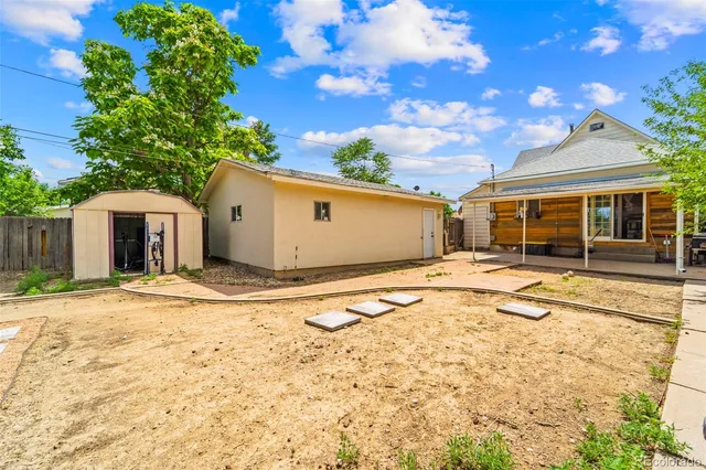 a house with trees in the background