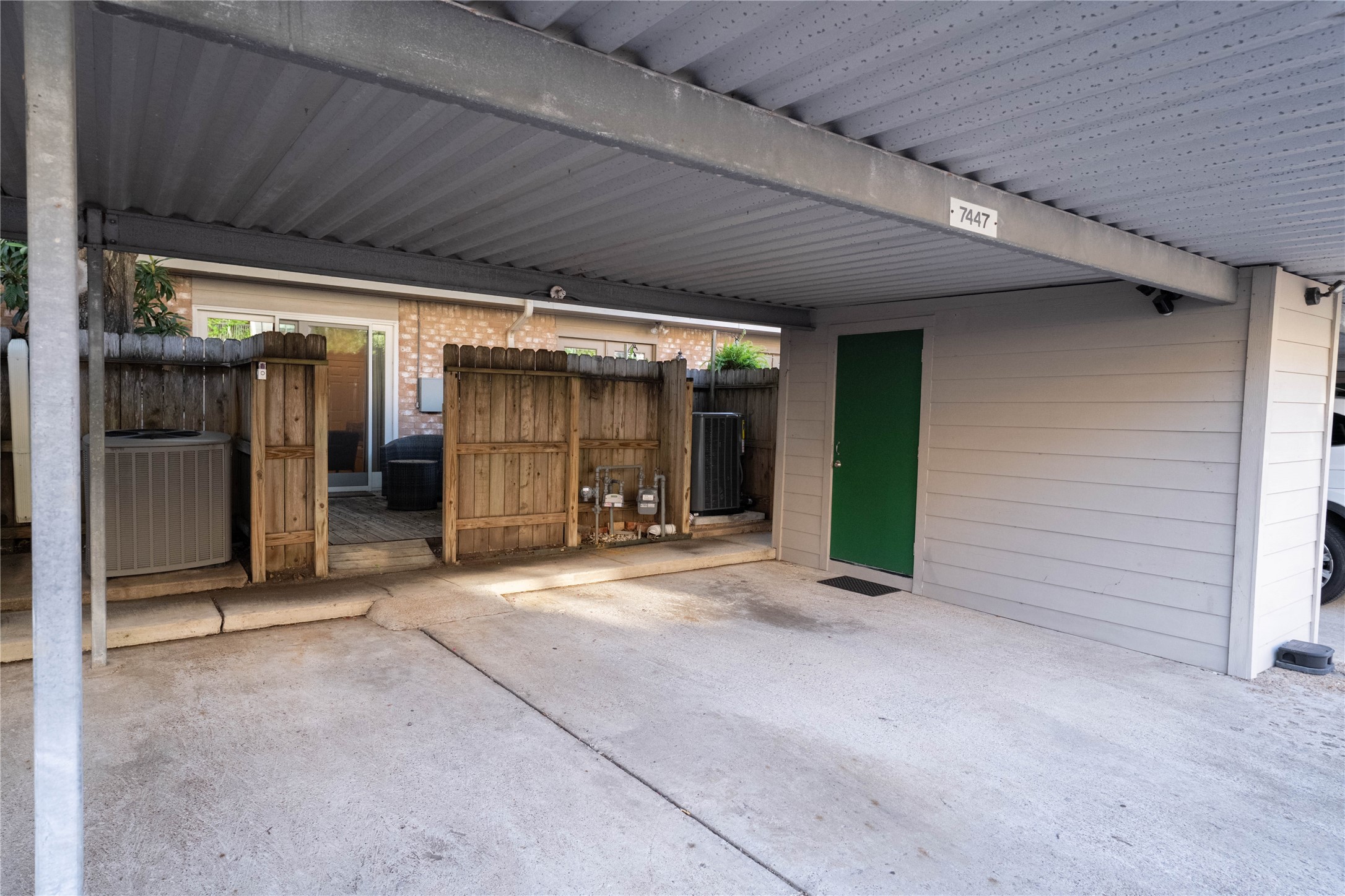 7447 Brompton Street, Unit 7447 Houston, TX 77025 - Photo 26 of 27 Additional storage space is available in the back of the house, adjacent to the covered parking area.