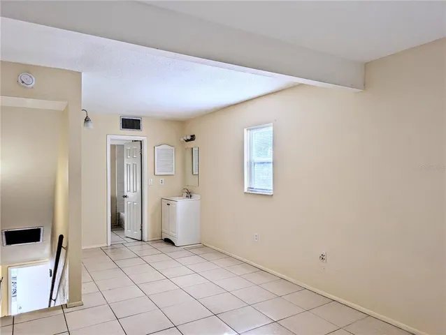 a view of a storage & utility room with empty racks