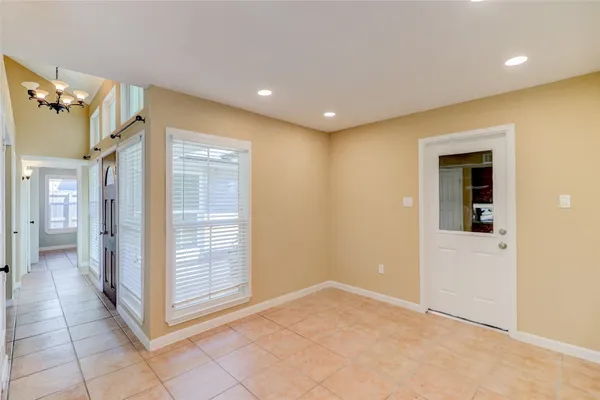a bathroom with a tub sink and a window