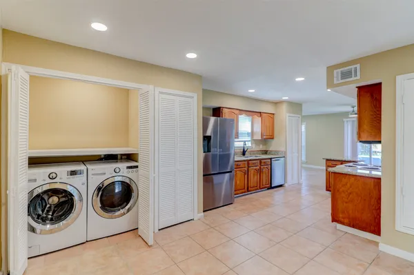 a view of a house with yard and a tree