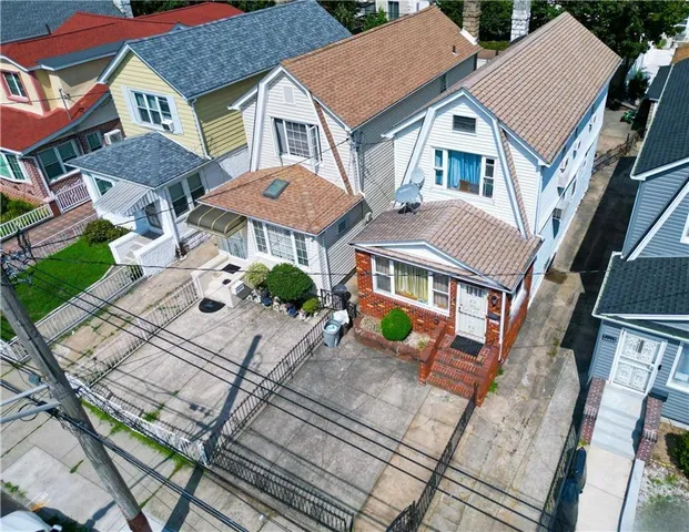 an aerial view of residential house with outdoor space