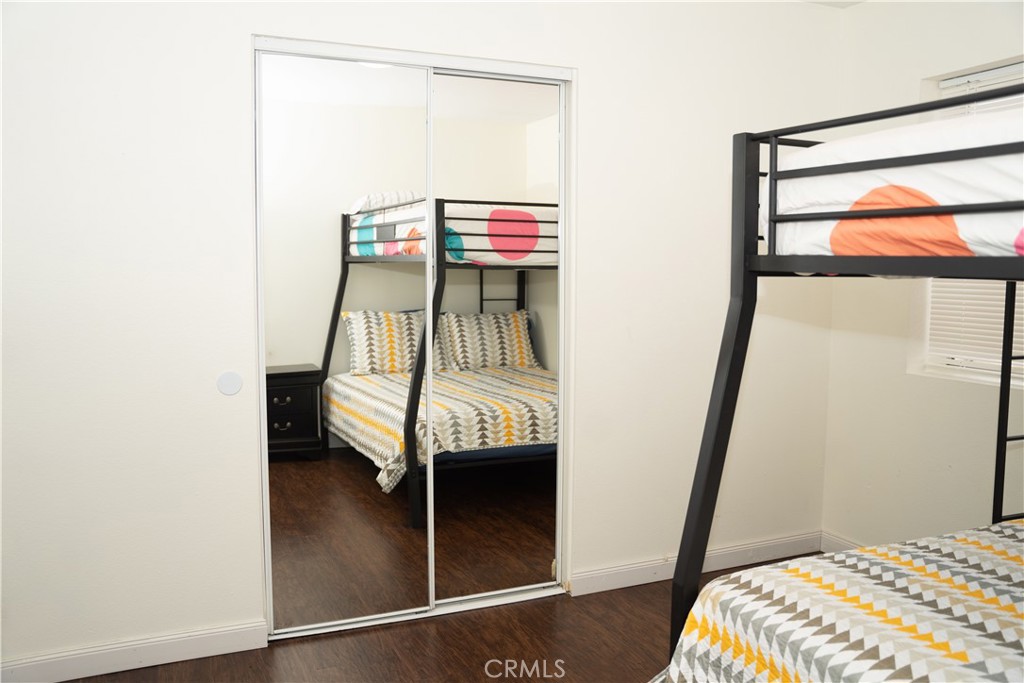 13655 El Rio Lane Desert Hot Springs, CA 92240 - Photo 16 of 27 a bedroom with a bed and a window