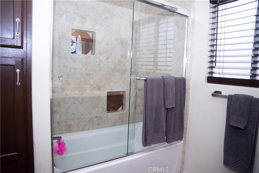 13655 El Rio Lane Desert Hot Springs, CA 92240 - Photo 18 of 27 a bathroom with a bathtub and shower