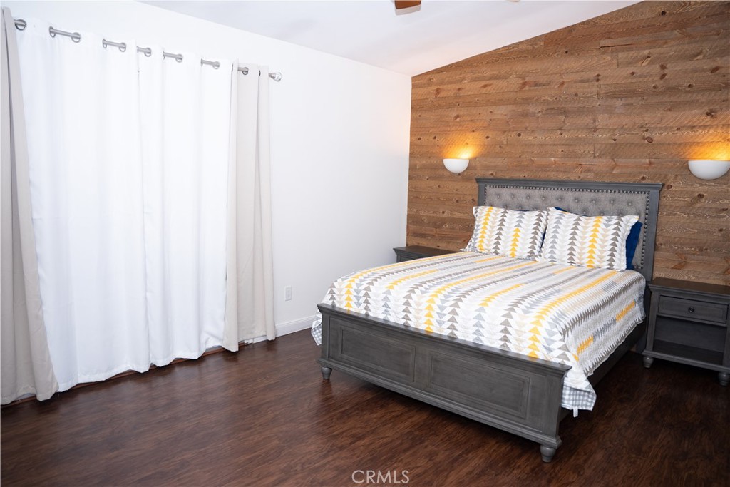 13655 El Rio Lane Desert Hot Springs, CA 92240 - Photo 20 of 27 a bed sitting in a bedroom next to a window