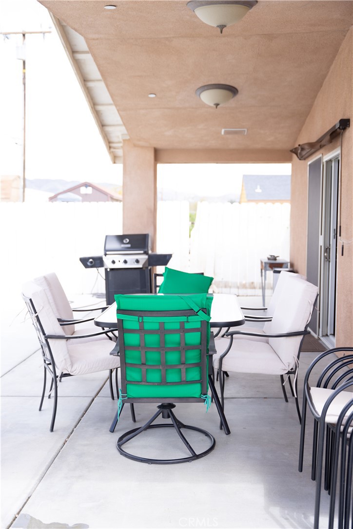13655 El Rio Lane Desert Hot Springs, CA 92240 - Photo 26 of 27 a view of a dining room with furniture window and outside view