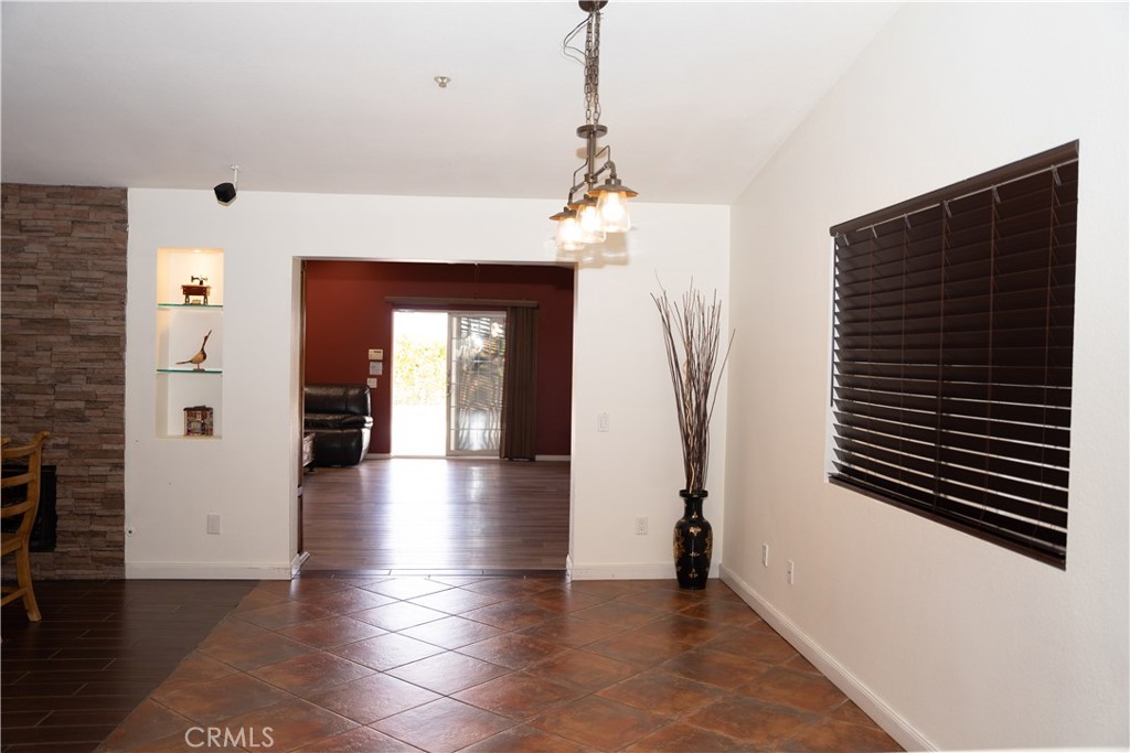 13655 El Rio Lane Desert Hot Springs, CA 92240 - Photo 6 of 27 a view of a hallway view with wooden floor and staircase