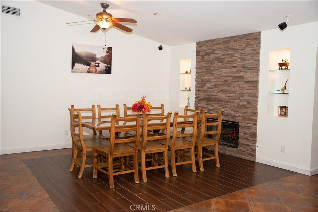 13655 El Rio Lane Desert Hot Springs, CA 92240 - Photo 8 of 27 a view of a dining room with furniture and wooden floor