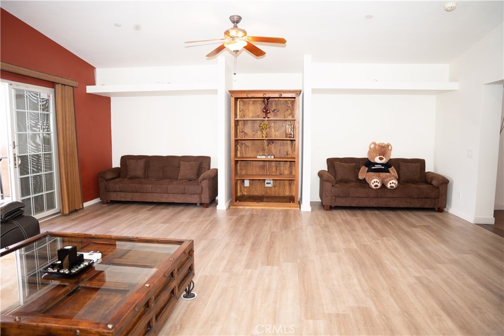 13655 El Rio Lane Desert Hot Springs, CA 92240 - Photo 9 of 27 a living room with furniture and wooden floor