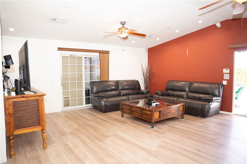 13655 El Rio Lane Desert Hot Springs, CA 92240 - Photo 10 of 27 a living room with furniture and a flat screen tv