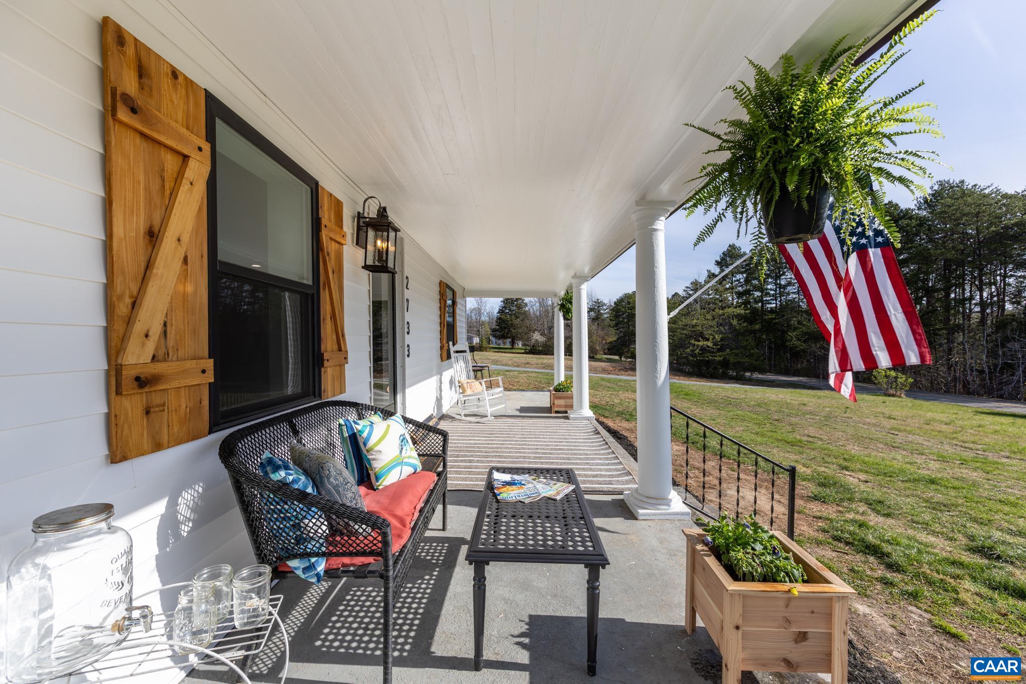 2733 Cedar Lane Road Kents Store, VA 23084 - Photo 3 of 43 Stunning full length covered front porch invites you to slow down and enjoy the beauty of the surrounding countryside. Plenty of room for family and friends to rock the day away while sipping sweet tea.