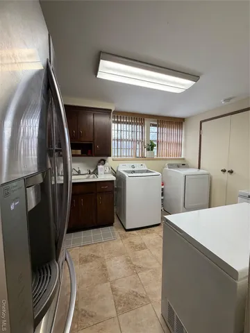 a kitchen with stainless steel appliances a refrigerator and a sink