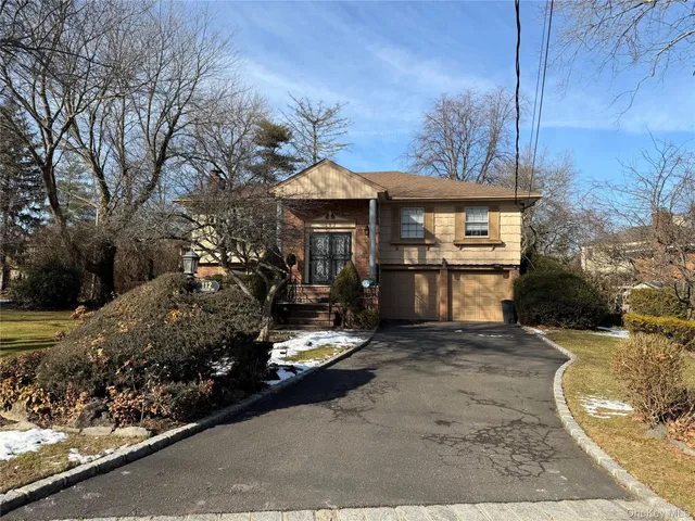 a view of a car park in front of house