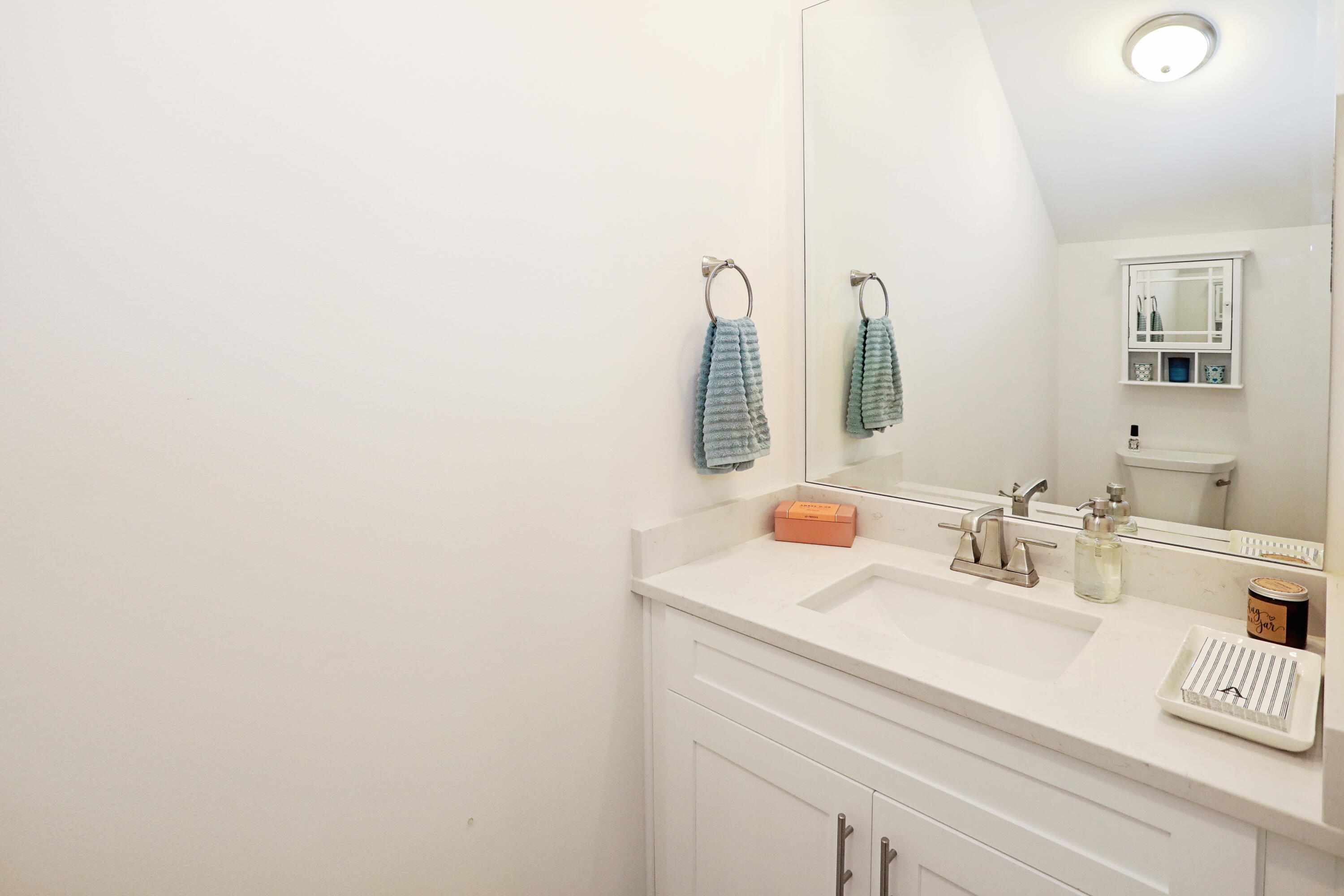 284 Windrow Way Inlet Beach Inlet Beach, FL 32461 - Photo 20 of 41 a bathroom with a sink and a mirror