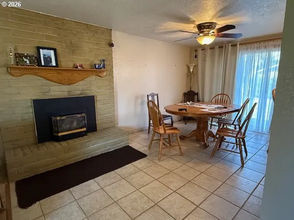 a view of a livingroom with furniture and a fireplace