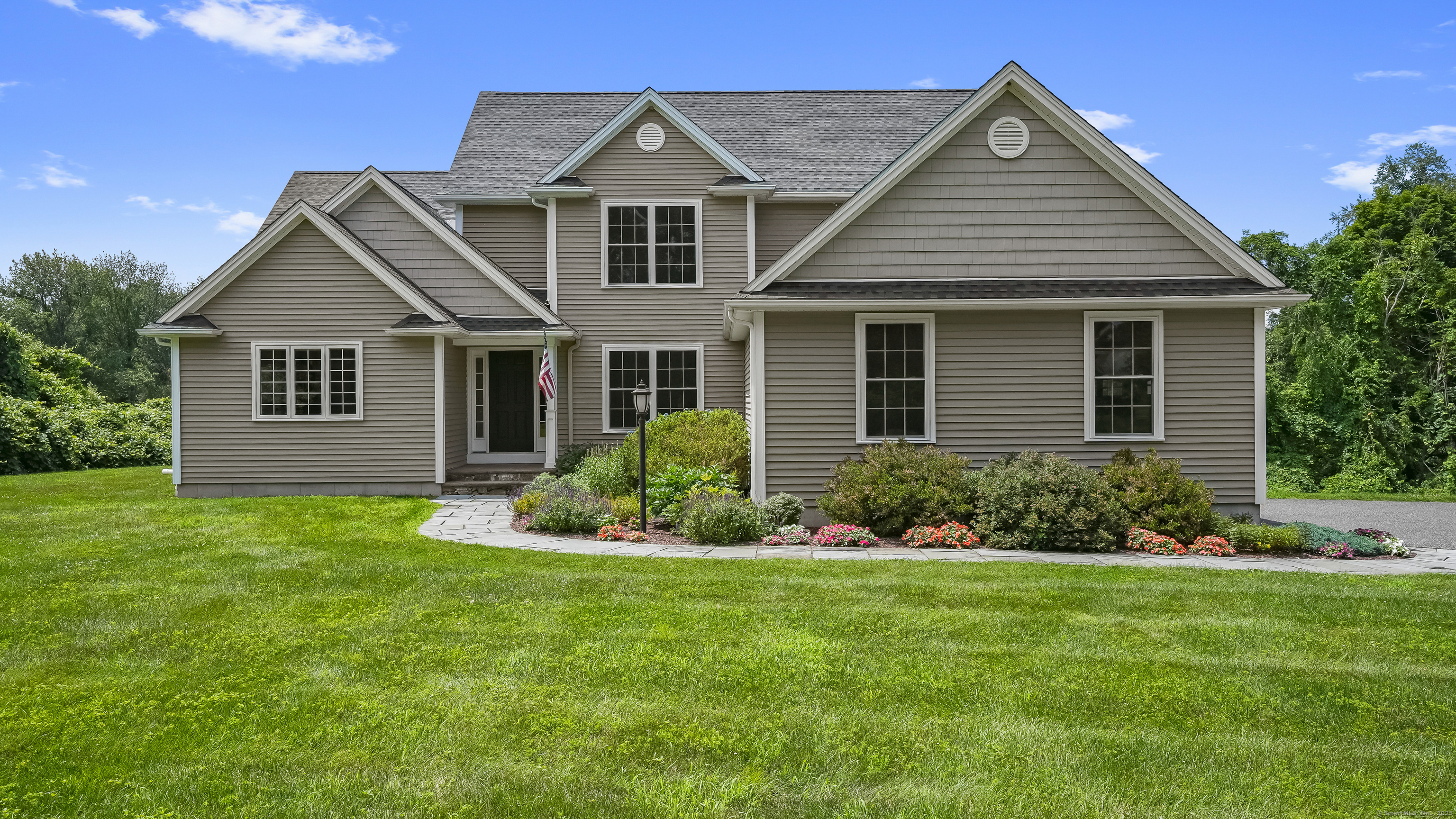 front view of a house with a yard