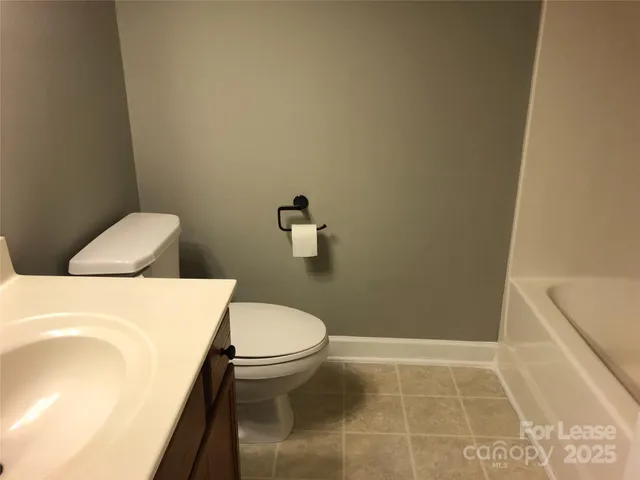 a bathroom with a sink and toilet