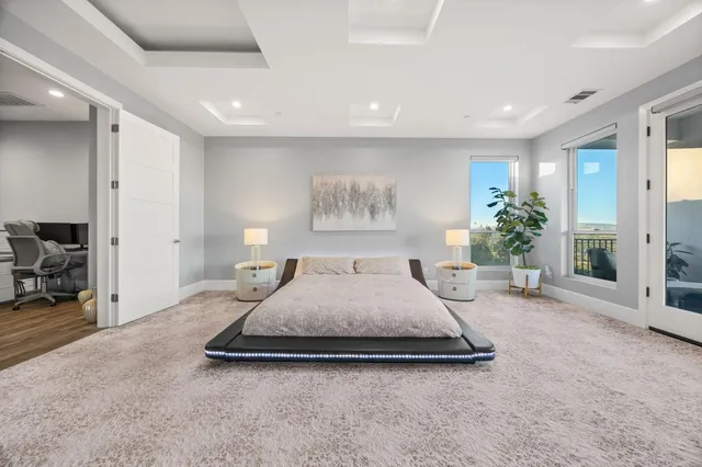 a bathroom with a tub shower sink and mirror