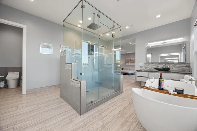 a view of a dining room with furniture and a potted plant
