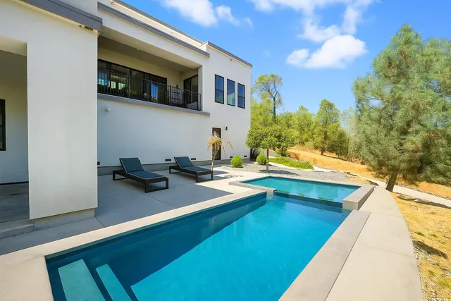 an aerial view of a house with outdoor space
