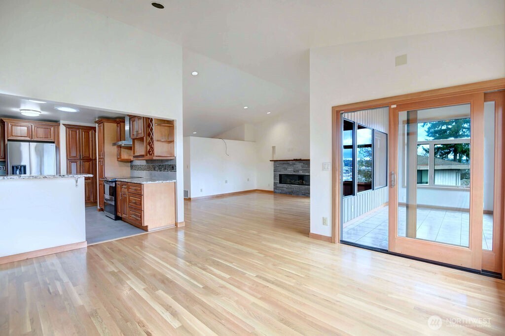 4322 29th Avenue West Seattle, WA 98199 - Photo 16 of 39 a view of a kitchen with wooden floor