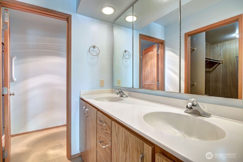 4322 29th Avenue West Seattle, WA 98199 - Photo 21 of 39 a bathroom with a sink and a mirror