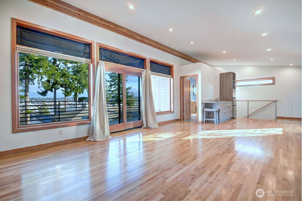 4322 29th Avenue West Seattle, WA 98199 - Photo 27 of 39 a view of livingroom with furniture wooden floor and window