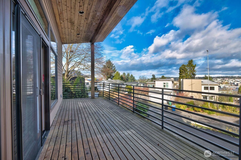 4322 29th Avenue West Seattle, WA 98199 - Photo 3 of 39 a view of a balcony with wooden floor