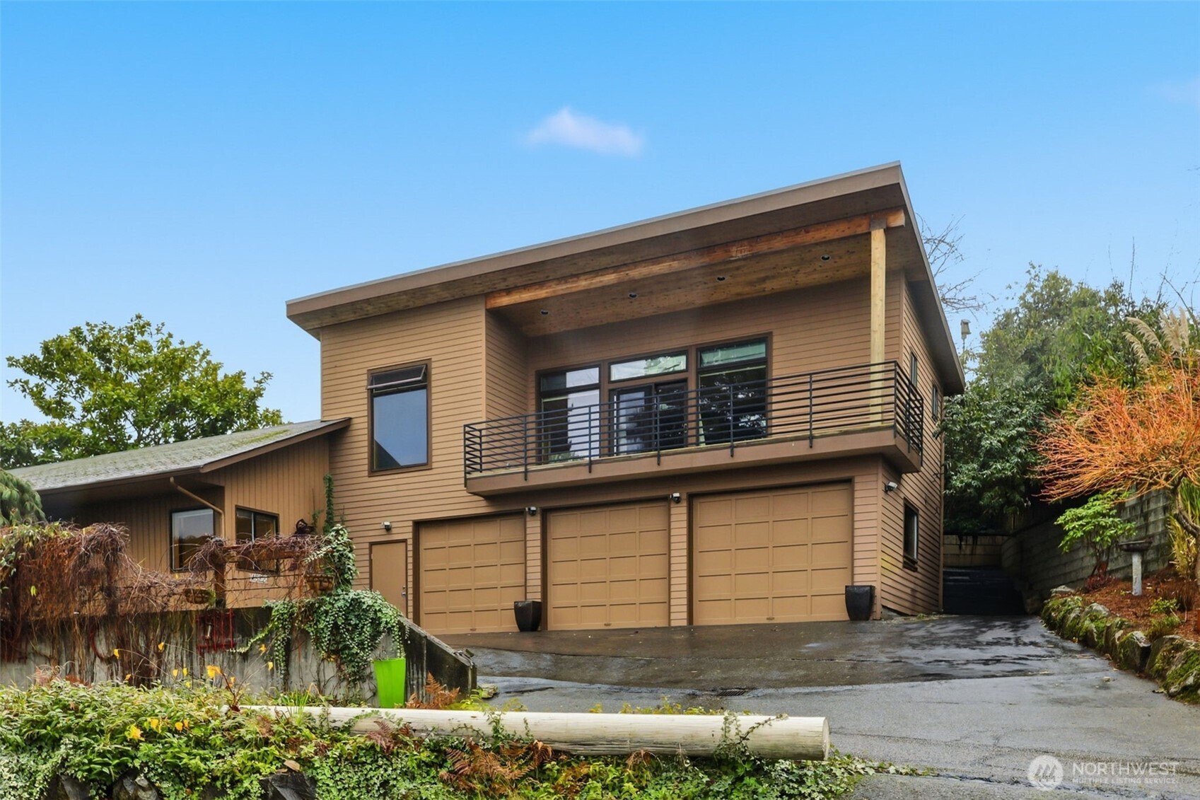 4322 29th Avenue West Seattle, WA 98199 - Photo 39 of 39 a front view of a house with a yard