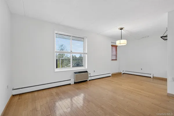 a view of an empty room with a window