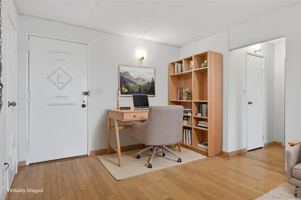 a workspace with furniture and wooden floor