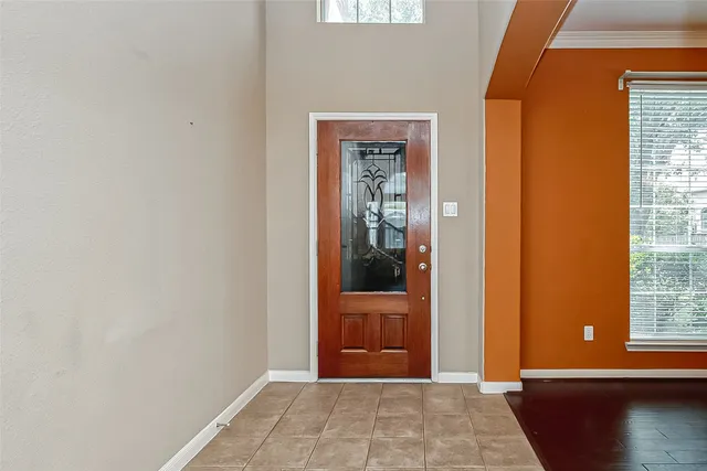 a view of a door and wooden floor