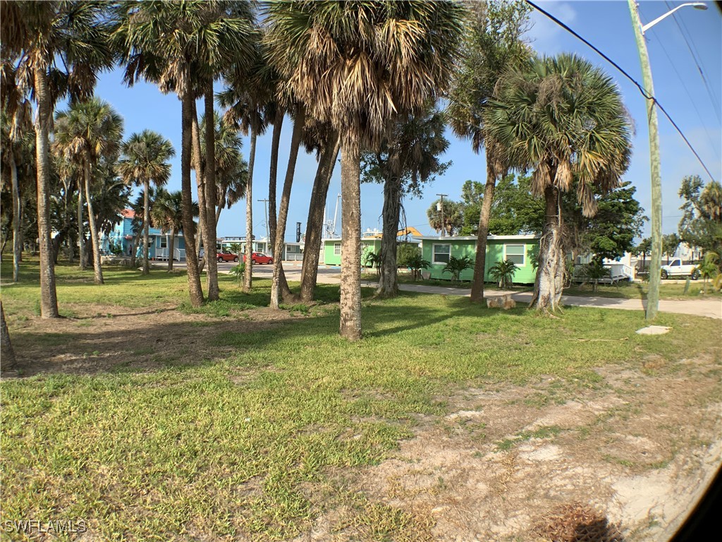 1180 Main Street, Unit 6 Fort Myers Beach, FL 33931 - Photo 15 of 18 a view of a park with palm trees