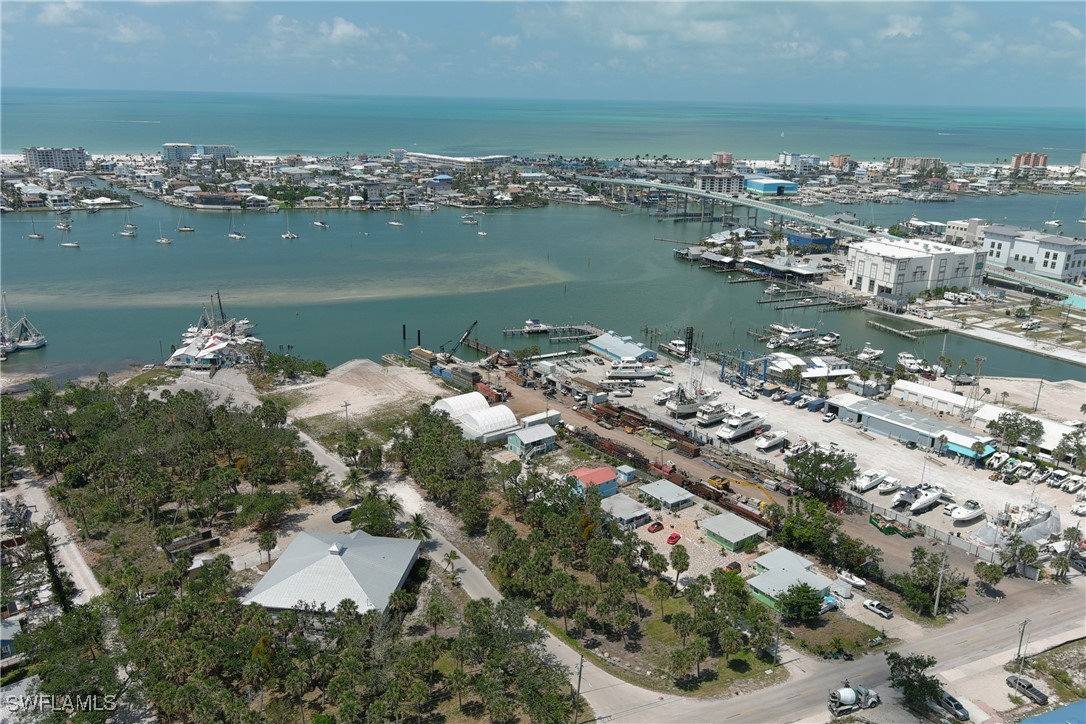 1180 Main Street, Unit 6 Fort Myers Beach, FL 33931 - Photo 3 of 18 an aerial view of a houses with outdoor space