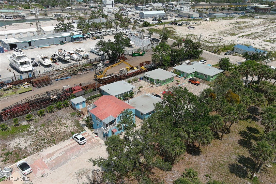 1180 Main Street, Unit 6 Fort Myers Beach, FL 33931 - Photo 4 of 18 an aerial view of residential house with outdoor space and parking