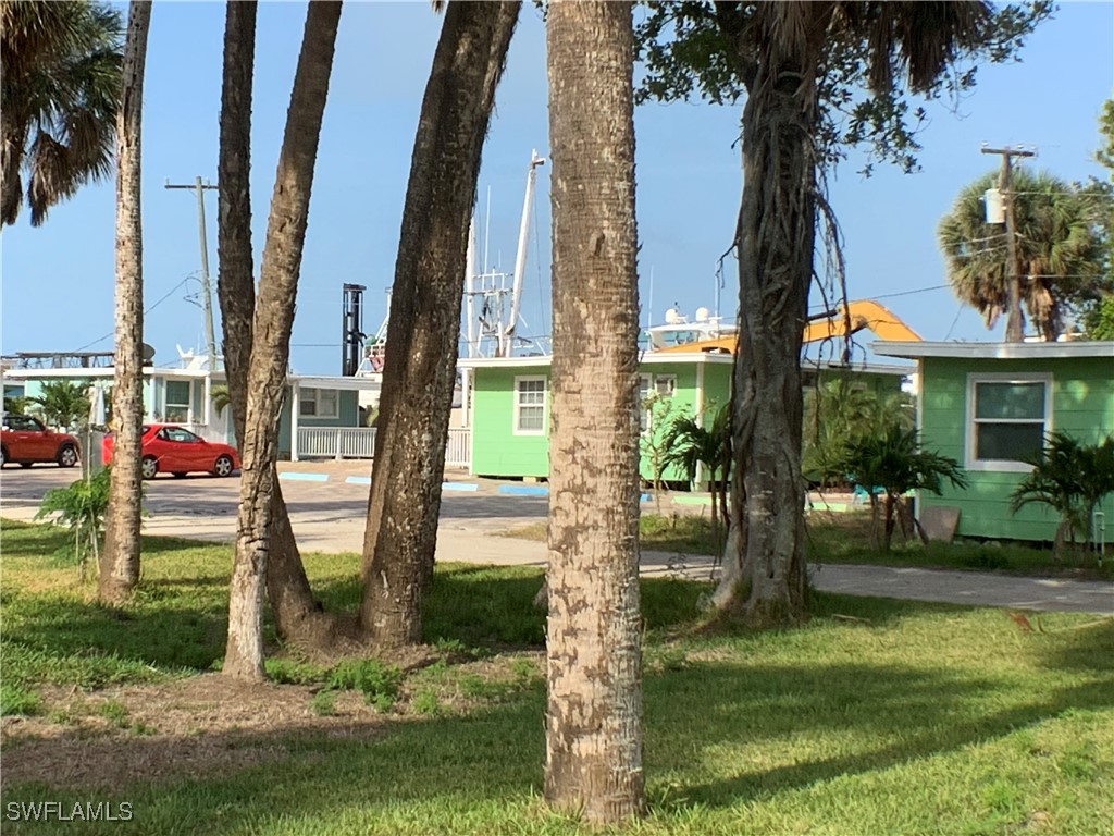 1180 Main Street, Unit 6 Fort Myers Beach, FL 33931 - Photo 7 of 18 a view of outdoor space yard and porch