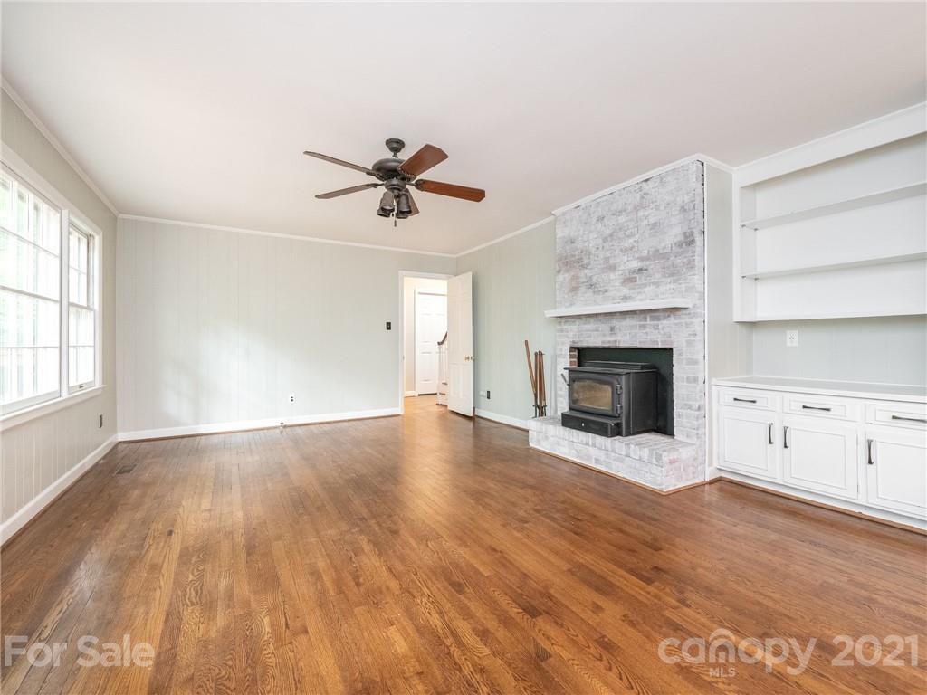 925 Reverdy Lane Matthews, NC 28105 - Photo 15 of 36 an empty room with windows and fireplace