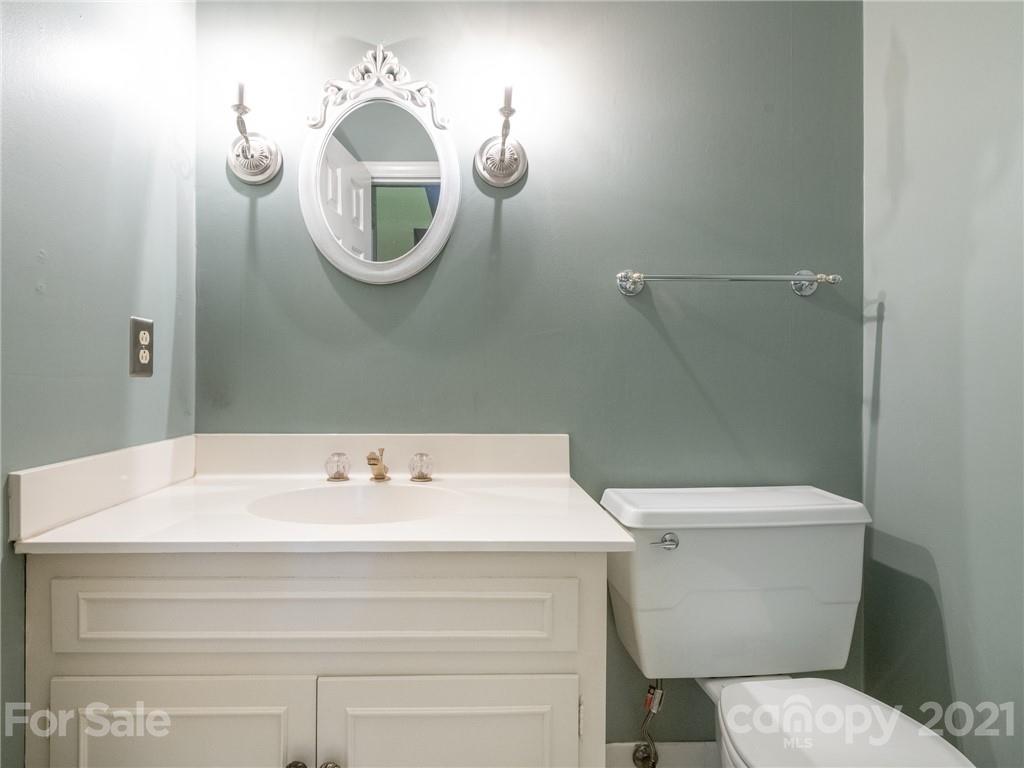 925 Reverdy Lane Matthews, NC 28105 - Photo 16 of 36 a bathroom with a sink and a mirror