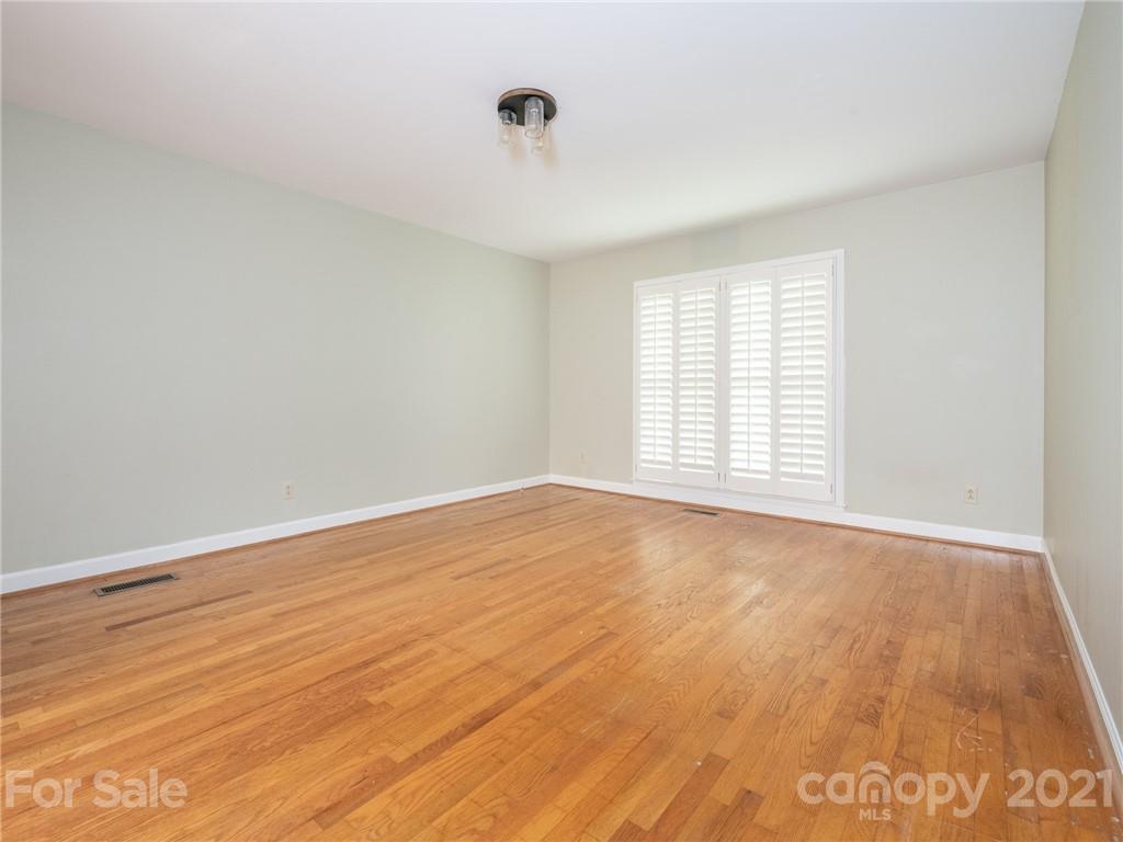 925 Reverdy Lane Matthews, NC 28105 - Photo 17 of 36 wooden floor in an empty room with a window