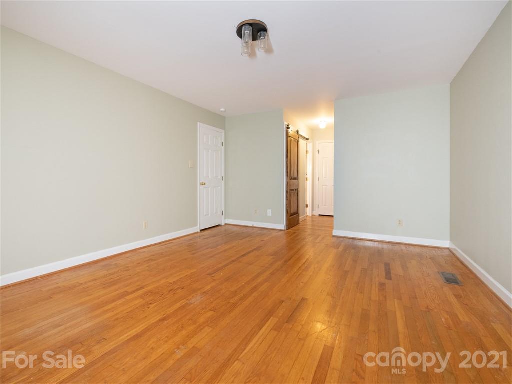 925 Reverdy Lane Matthews, NC 28105 - Photo 18 of 36 a view of an empty room and wooden floor