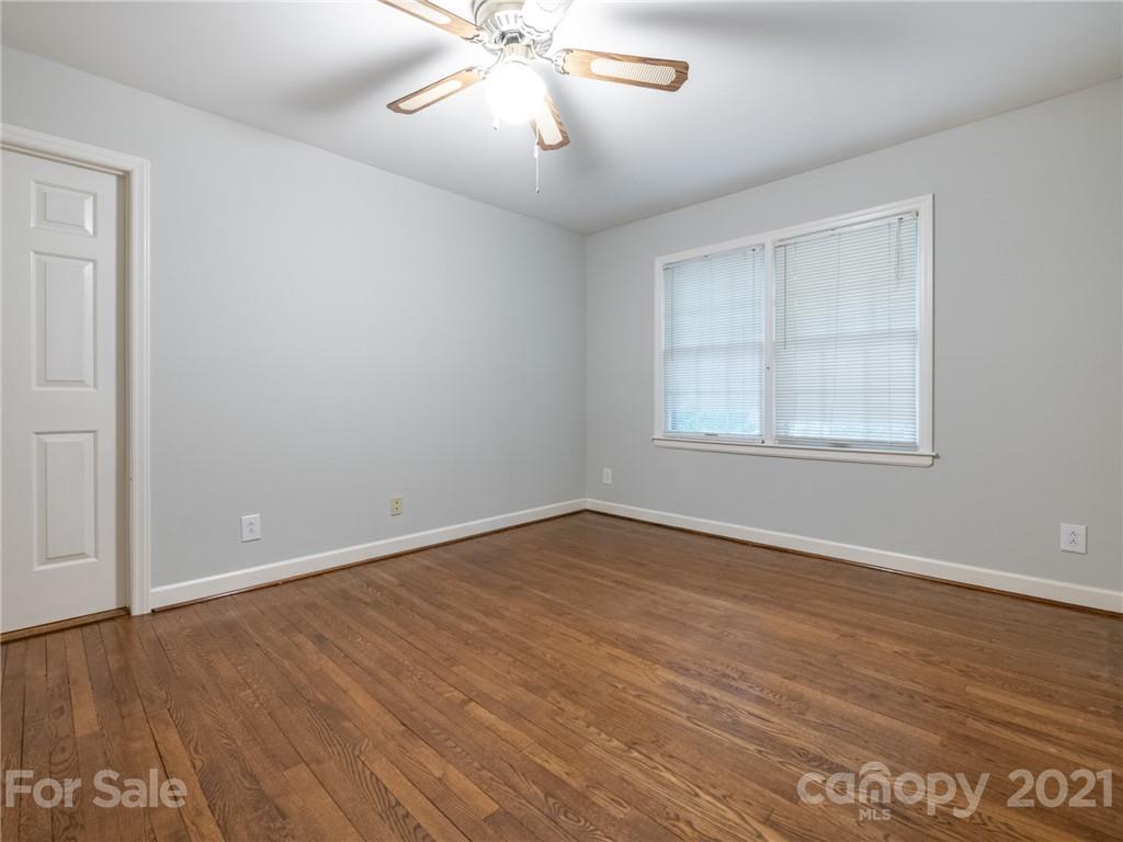 925 Reverdy Lane Matthews, NC 28105 - Photo 22 of 36 wooden floor in an empty room with a window