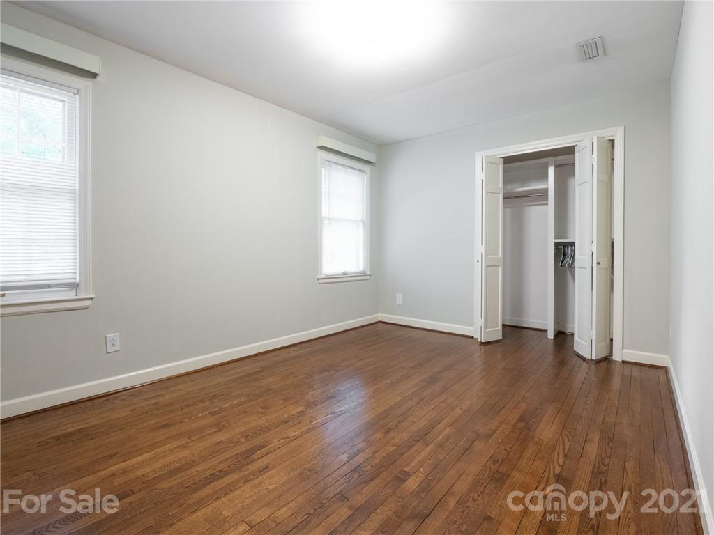 925 Reverdy Lane Matthews, NC 28105 - Photo 26 of 36 an empty room with wooden floor and windows